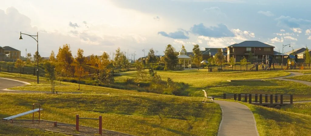 Photo of residential estate in the morning with green hills and homes