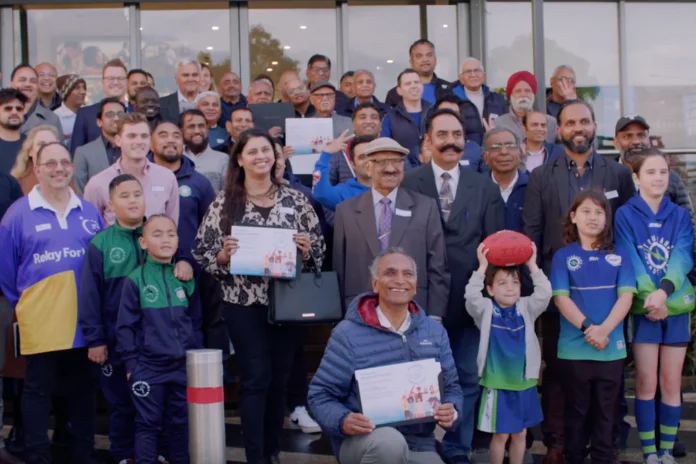 People celebrating outside the sales centre in Westbrook estate