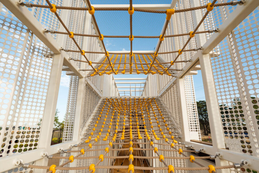 Entry to yellow and white playground equipment